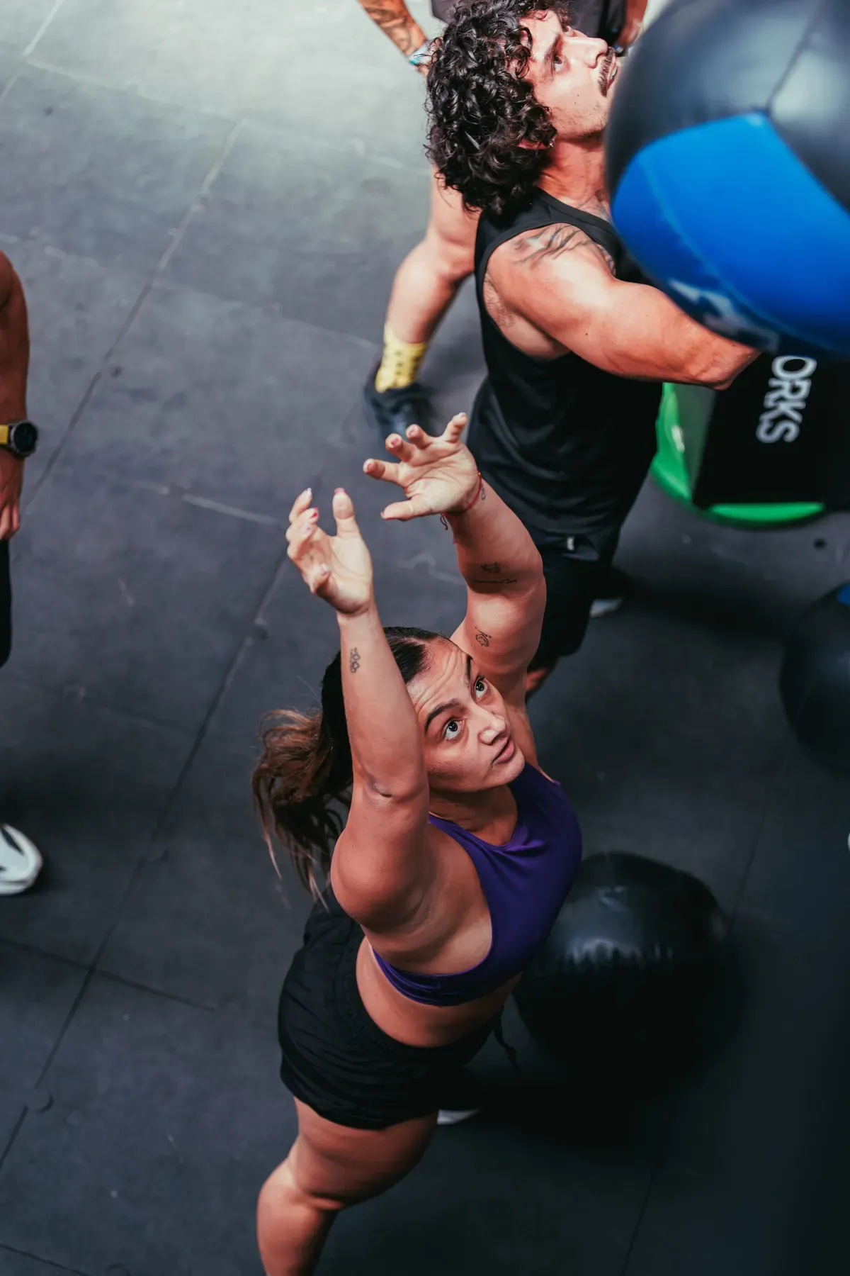 Guests throwing wall balls during a high-intensity conditioning workout in Phuket