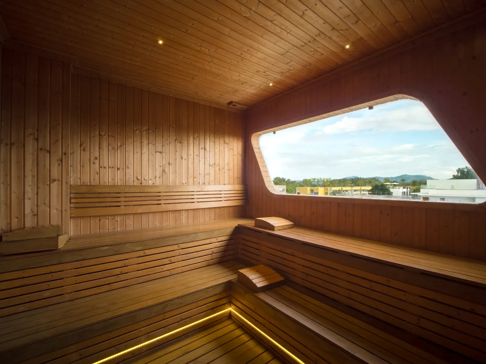 The Sole Mio spa sauna with a panoramic window over the Phuket hills