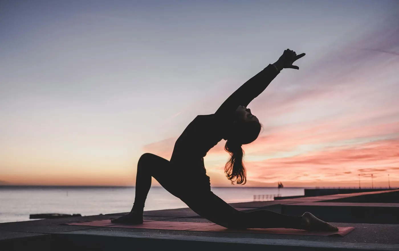 Group sunrise yoga and wellness practice in Thailand